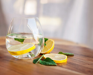 a glass of water with lemon