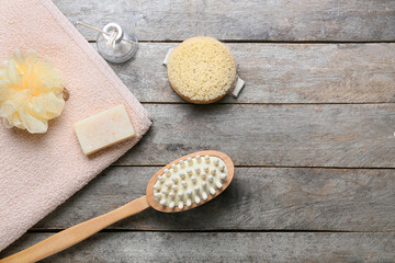 Composition with different massage brushes on wooden background