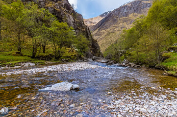 A view down the River Nevis towards rapids in Glen Nevis, Scotland on a summers day