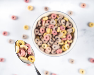 Coloful Cereal breakfast rings Loops in a Bowl with spoon