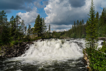view of the Dimforsen waterfall in northern Sweden