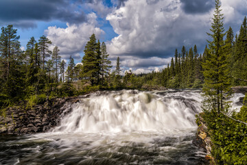 view of the Dimforsen waterfall in northern Sweden