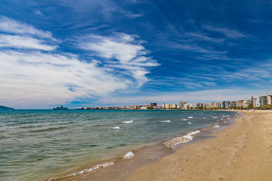 City beach of Vlora resort town, Albania. Summer sunny day. View of the city and the adriatic sea
