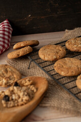 Chopped view and close up of oatmeal raisin cookies on a wire rack. Natural nutrition concept.