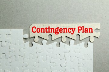 white puzzle with the word contingency plan