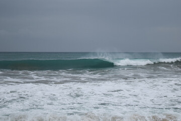 Stormy ocean view with big waves breaking on the Atlantic Ocean in Spain. Winter Atlantic storm with big breaking waves