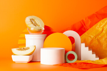 Composition of plaster decorations of different geometries on orange background