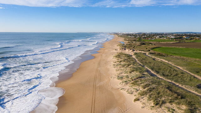 Amazing aerial bird view of atlantic coast in south Spain Andalusia beach. Mangueta Beach in Cadiz seen from above with beautiful natural landscape near cape of Trafalgar