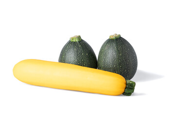 Two realistic looking globe or eight ball squash or zucchini or round courgette  and a yellow courgette - cucurbita pepo - isolated white background