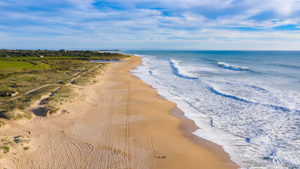 Amazing aerial bird view of atlantic coast in south Spain Andalusia beach. Mangueta Beach in Cadiz seen from above with beautiful natural landscape near cape of Trafalgar © Pablo