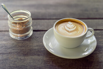 Latte art coffee in a white mug