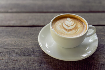 Latte art coffee in a white mug