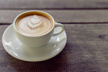 Latte art coffee in a white mug
