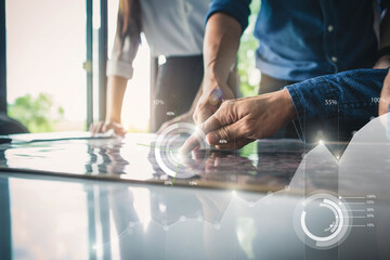 Business documents on office table with smart phone and digital tablet and graph financial. businessman hand working on laptop computer with financial Business graph information diagram in office.