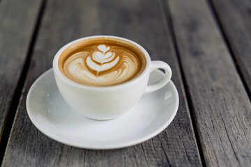 Latte art coffee in a white mug