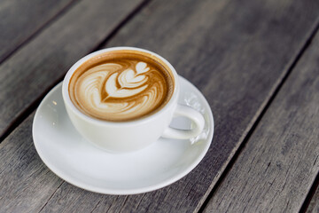 Latte art coffee in a white mug