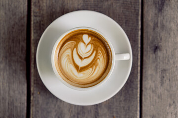 Latte art coffee in a white mug