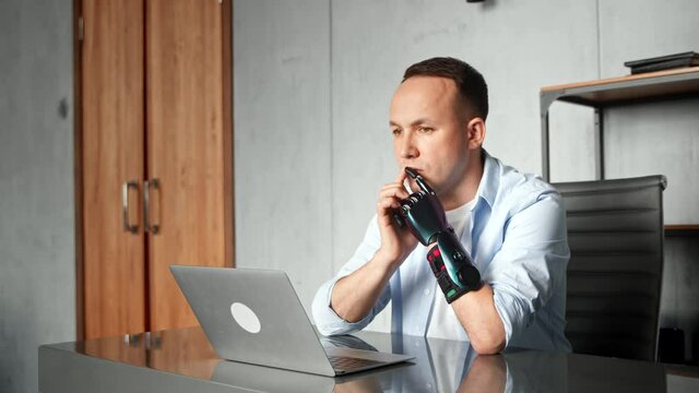 Serious man programmer with artificial limb prothesis