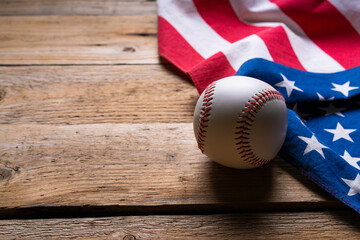 baseball with American flag on the wooden table background