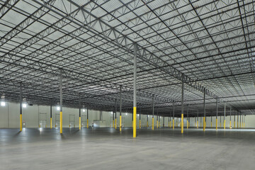 Interior of large empty industrial storage warehouse building