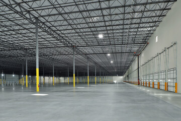 Interior of large empty warehouse industrial storage facility