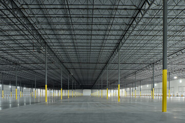 Large empty industrial storage warehouse building interior