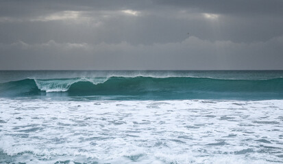 Stormy ocean view with big waves breaking on the Atlantic Ocean in Spain. Winter Atlantic storm with big breaking waves