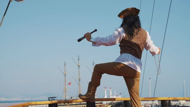 man in a pirate costume on a pirate ship