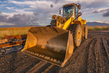 Excavator building a road in a site construction