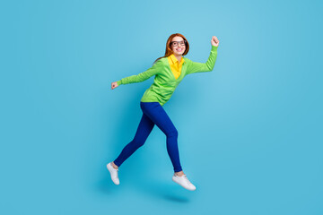 Fototapeta na wymiar Full length body size view of nice funny cheerful girl jumping walking isolated over bright blue color background