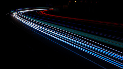 Night road lights. Lights of moving cars at night. long exposure multicolored