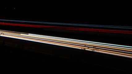 Night road lights. Lights of moving cars at night. long exposure multicolored