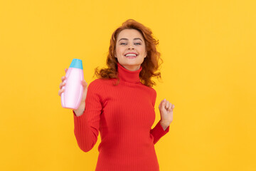 girl curly hair offer shampoo bottle. hair conditioner advertisement. beauty product.