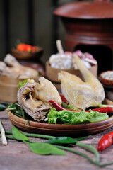 Ready-to-cook raw chicken with kitchen spices as decoration