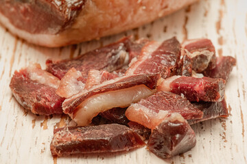 Sliced duck slices on a white board. Dried sliced duck.