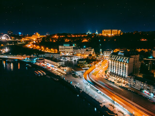 Fototapeta premium Aerial view from a drone of the embankment and the center of Kiev at night