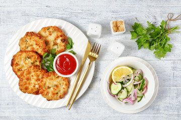 Cheesy Chicken Fritters on a plate, top view