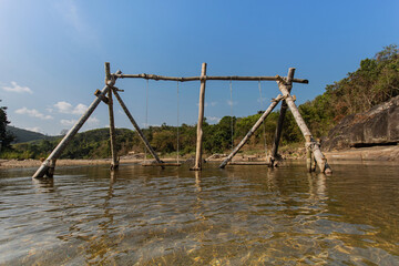 Fototapeta na wymiar wooden bridge over the river