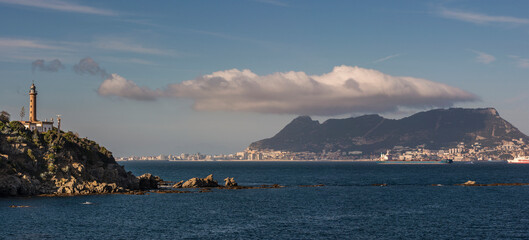 Panoramic view of Punta Carnero Lighthouse and the Rock of Gibraltar, near Algeciras, Cádiz province, Andalusia, Spain