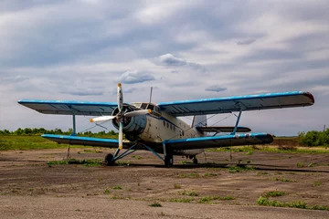 Acrylic prints Old airplane Abandoned planes old an-2 in the open air.