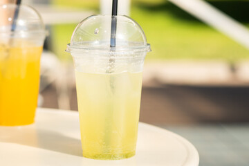 green refreshing lemonade cocktail on the veranda of the beach cafe