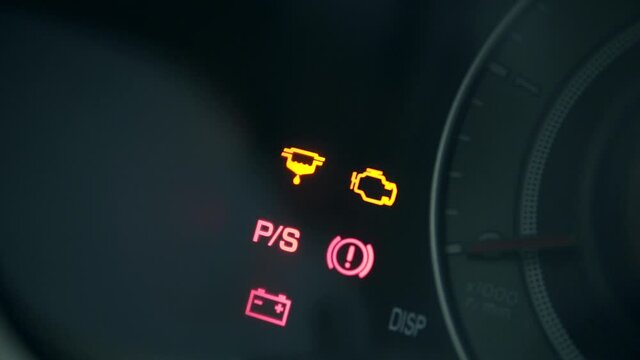 Car engine starting, dashboard icons appearing, engine service fault pictograms