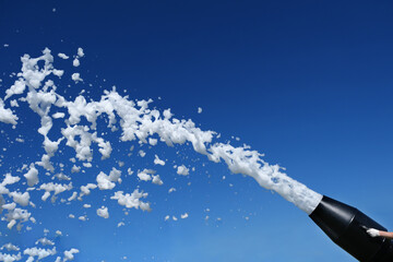 A foam party, a foam cannon against the blue sky. Man ejaculation. Explosion of sperm. - obrazy, fototapety, plakaty