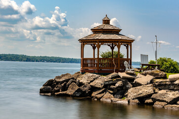Waterfront gazebo on a rocky pier on the St. Lawrence River