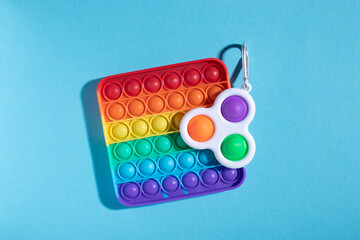 Rainbow antistress toys Pop It and Simple Dimple for the development of fine motor skills