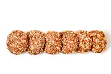 oatmeal cookies with cereals on a white background