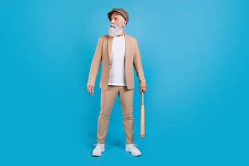 Full length body size view of attractive serious grey-haired man holding bet street fight isolated over bright blue color background