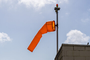 Windsock, wind cone or anemoscope, device designed to indicate the direction and strength of the...