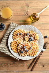blueberry waffles on a wooden background