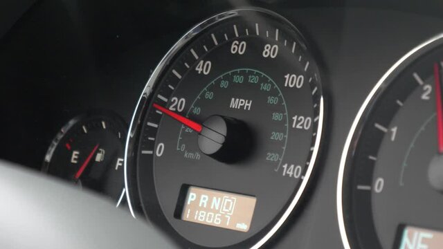 Speedometer on a car increasing from 0 to 40 miles per hour in slow motion and handheld.